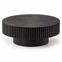 Fluted solid wood trim detail on round drum coffee table