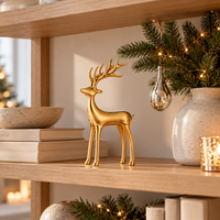 Gold metal reindeer figurine styled for Christmas
